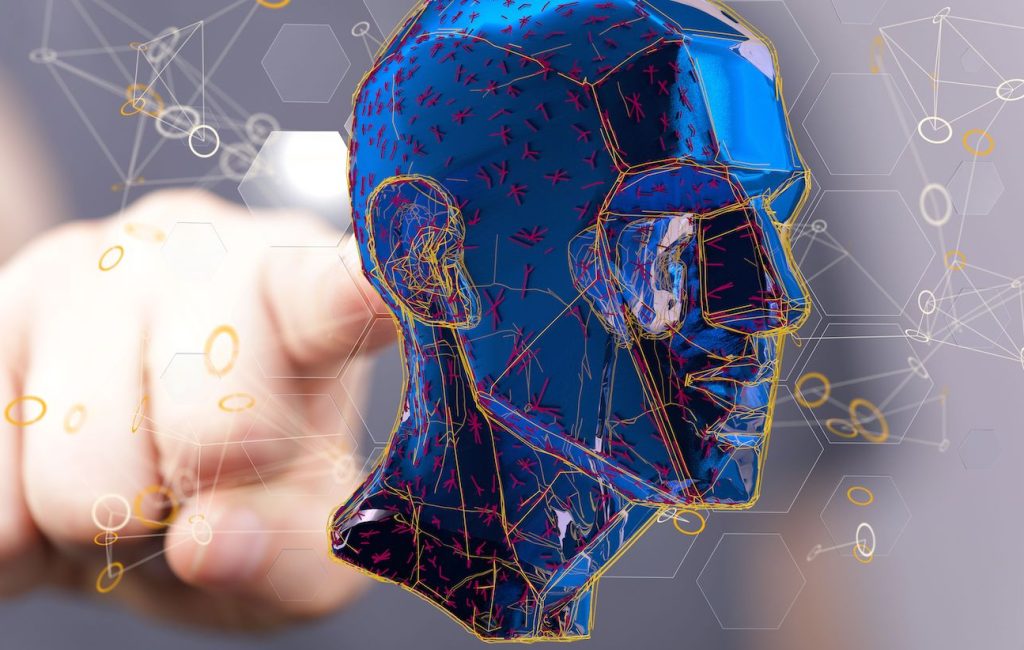 A 3D rendering of a blue head of a man and a hand behind